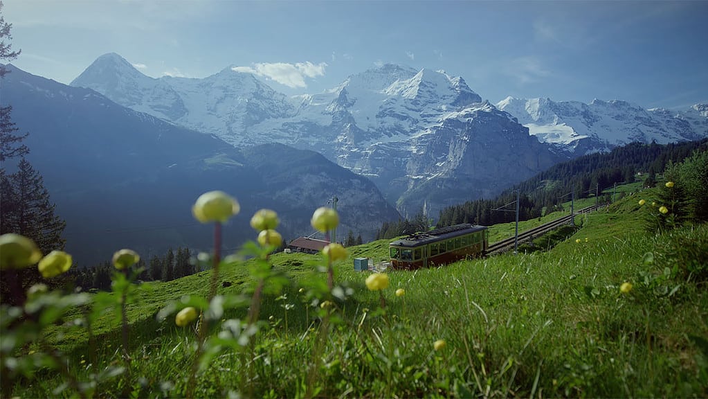 The BML Train from grütschalp to mürren with the bernese alps in the background