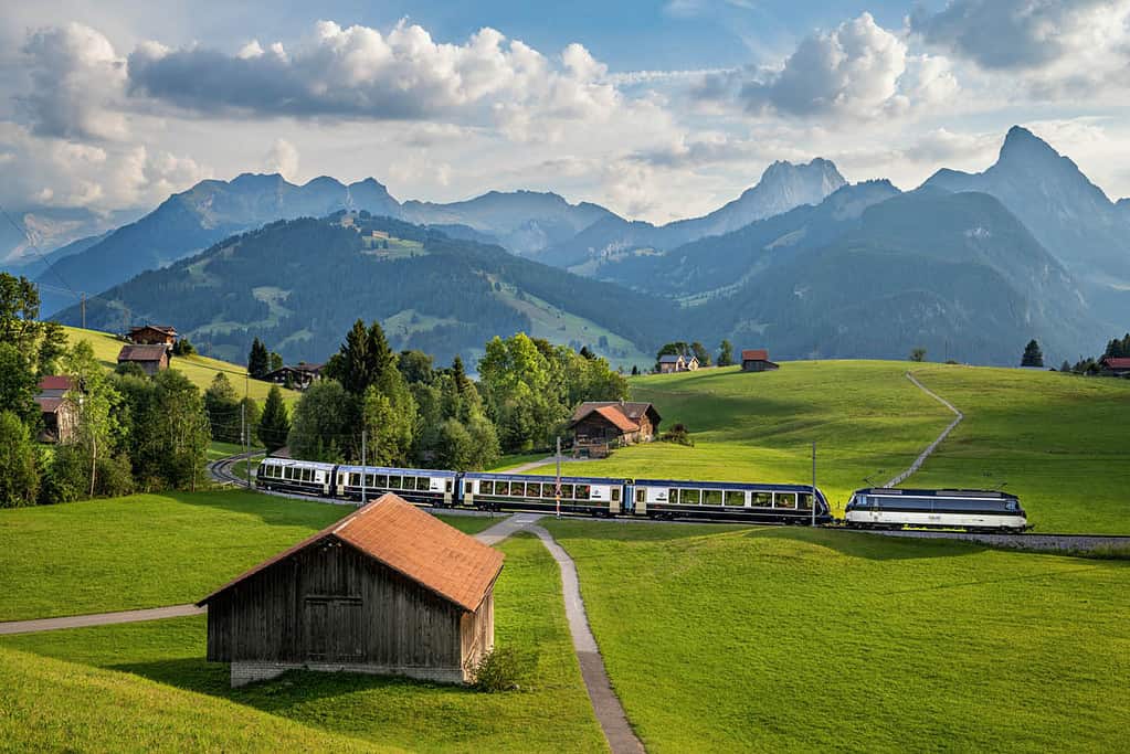 Panoramic train driving through scenic swiss landscape