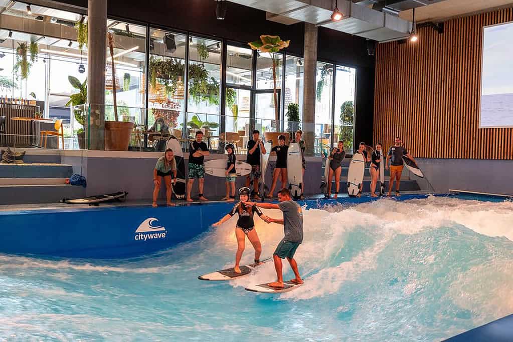 Kids learning to surf a the lucerne oana surf school