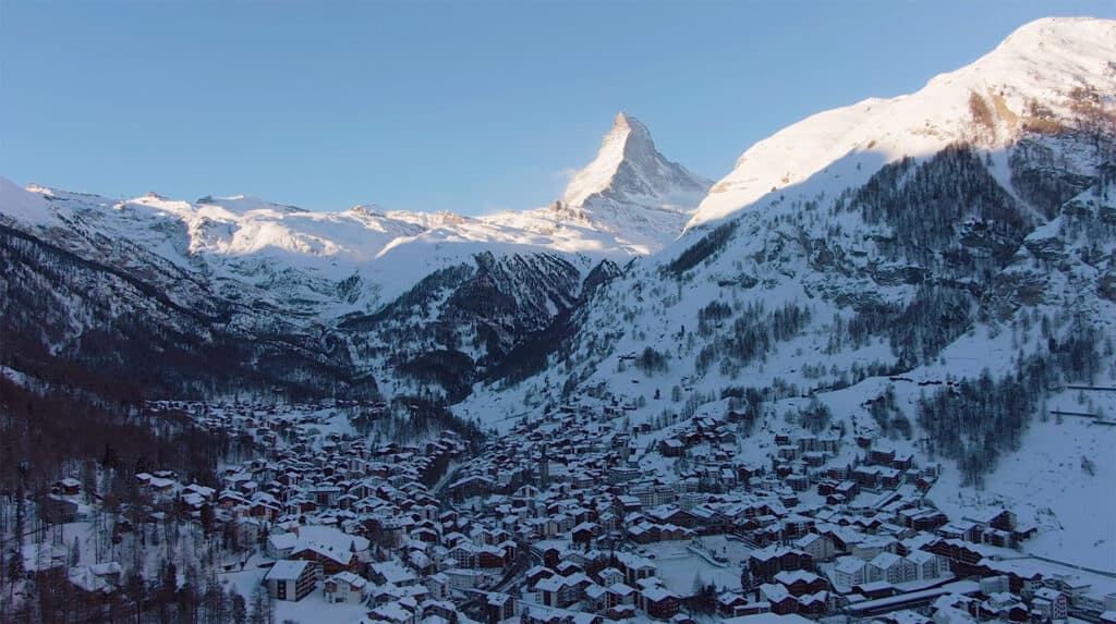 zermatt village with snow and the matterhorn in the background