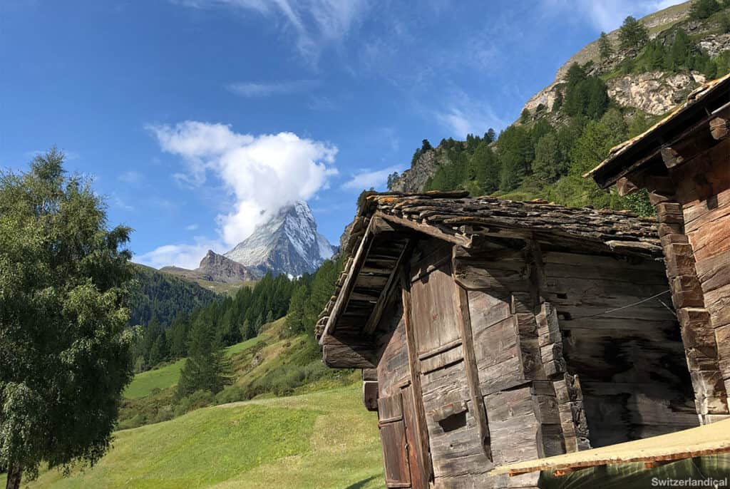 One of the scenic photo spots in Zermatt at Zen Stecken, a wooden barn with the Matterhorn peak in the background