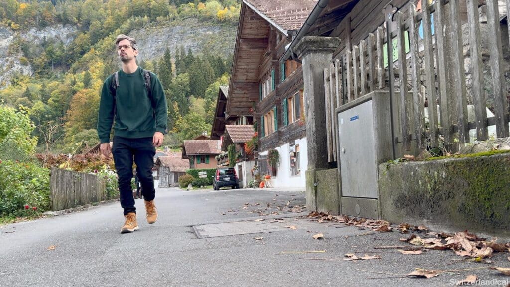 Switzerlandical author rocher walking through the iseltwald village
