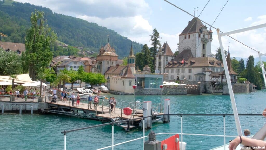 driving with the boat to the dock in Oberhofen, with the beautiful castle in the background