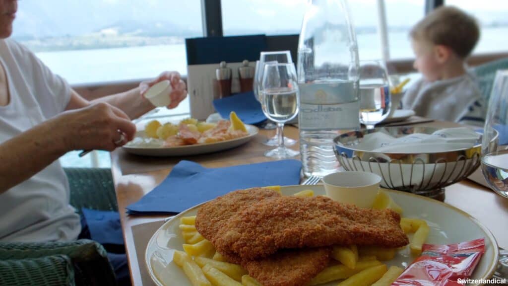 Photos of a plate with a schnitzel and fries